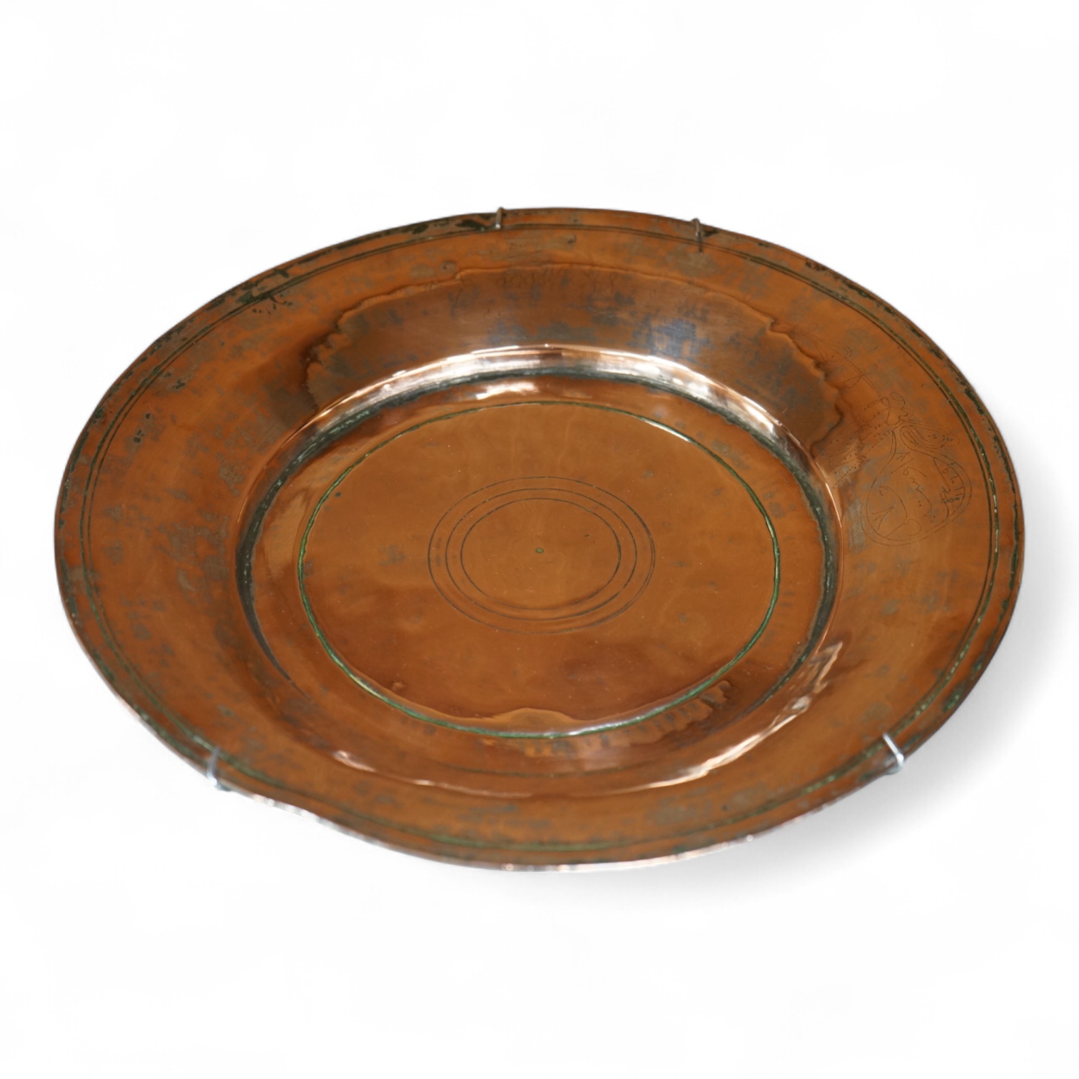 An 18th century Persian tinned copper dish, 34cm diameter.